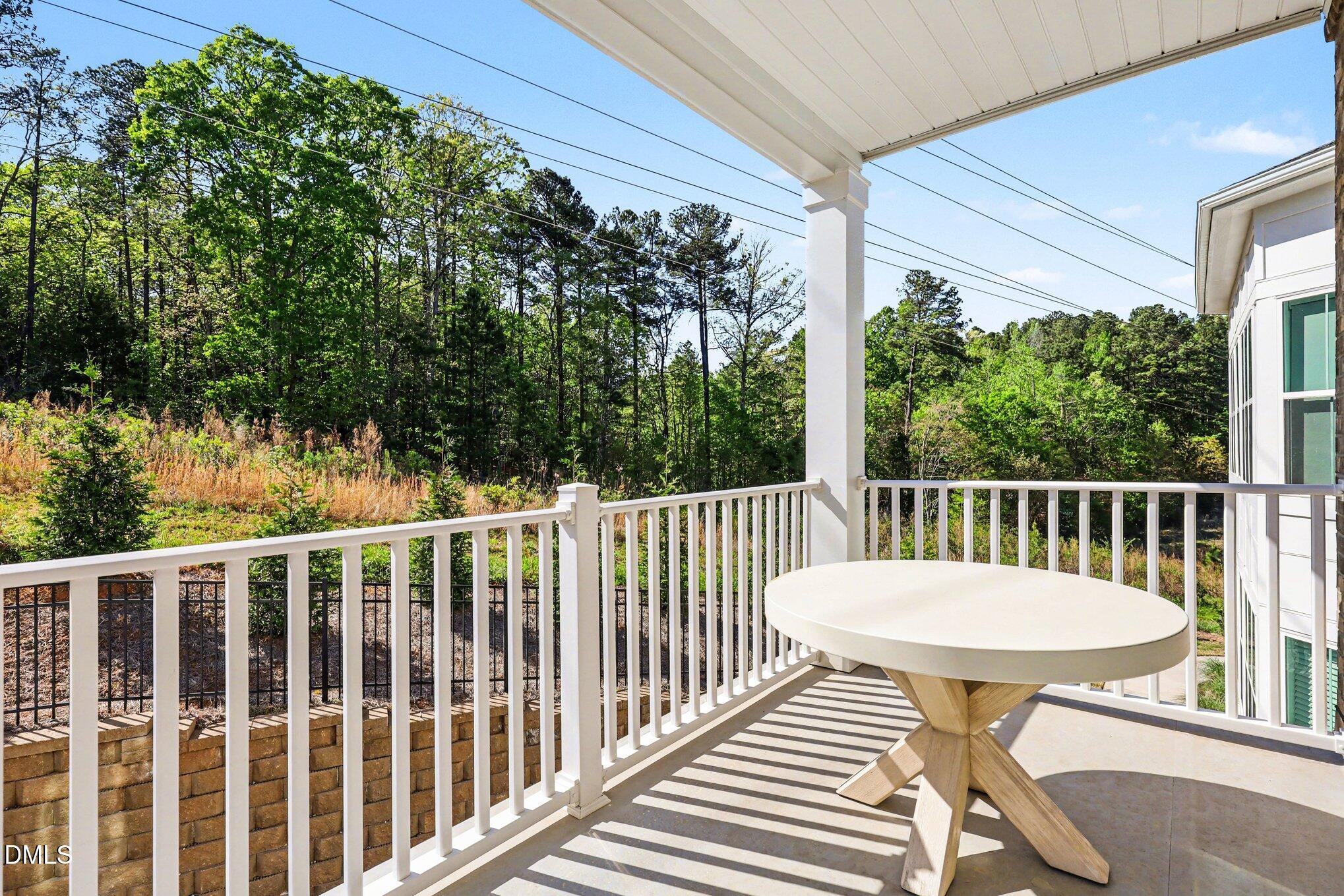 11549 Helmond Way, Unit 115 Raleigh, NC 27617 - Photo 11 of 25 a view of a patio with a table and chairs