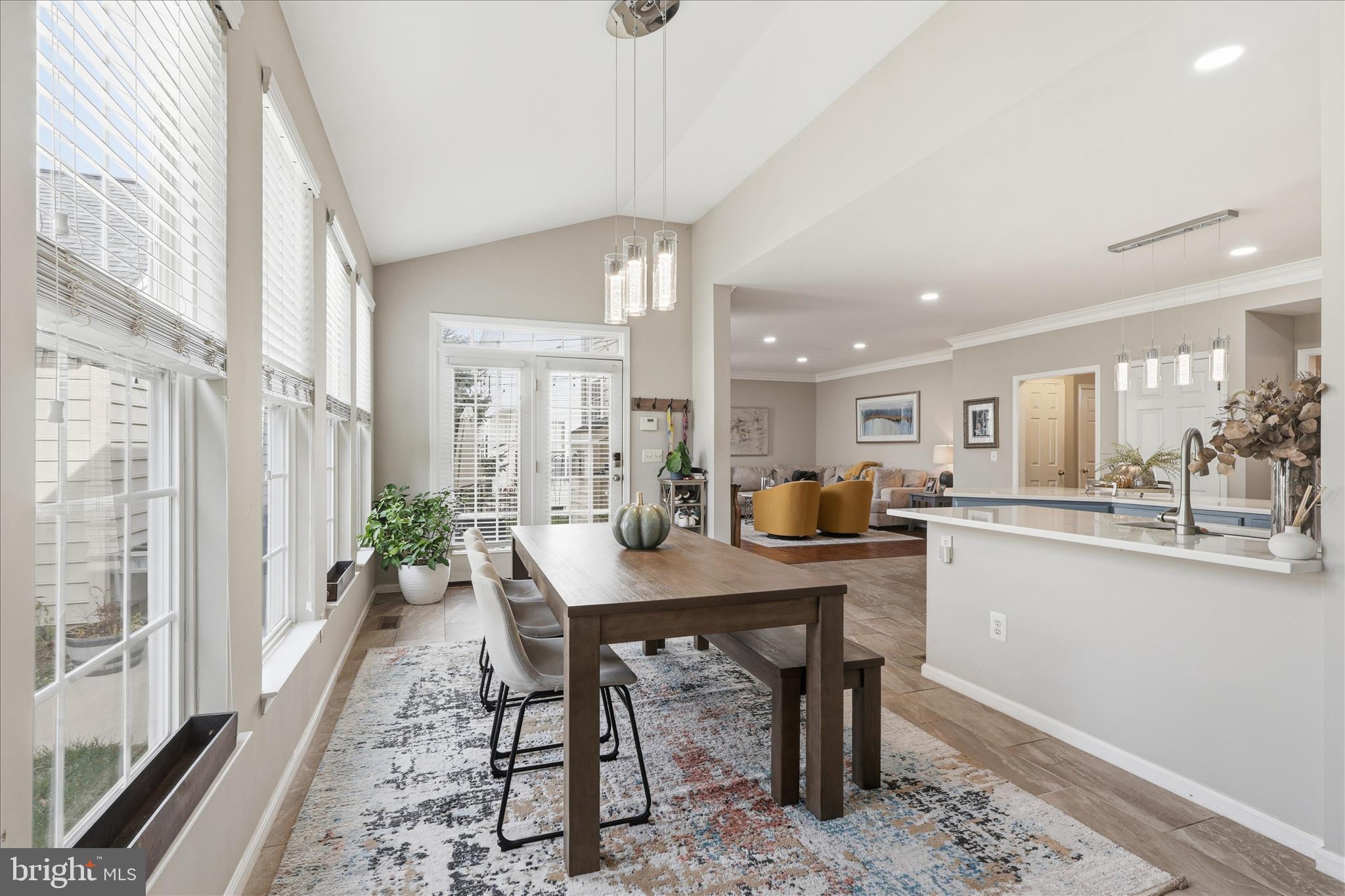 6711 Selbourne Lane Gainesville, VA 20155 - Photo 19 of 55 a view of a dining room with furniture window and wooden floor