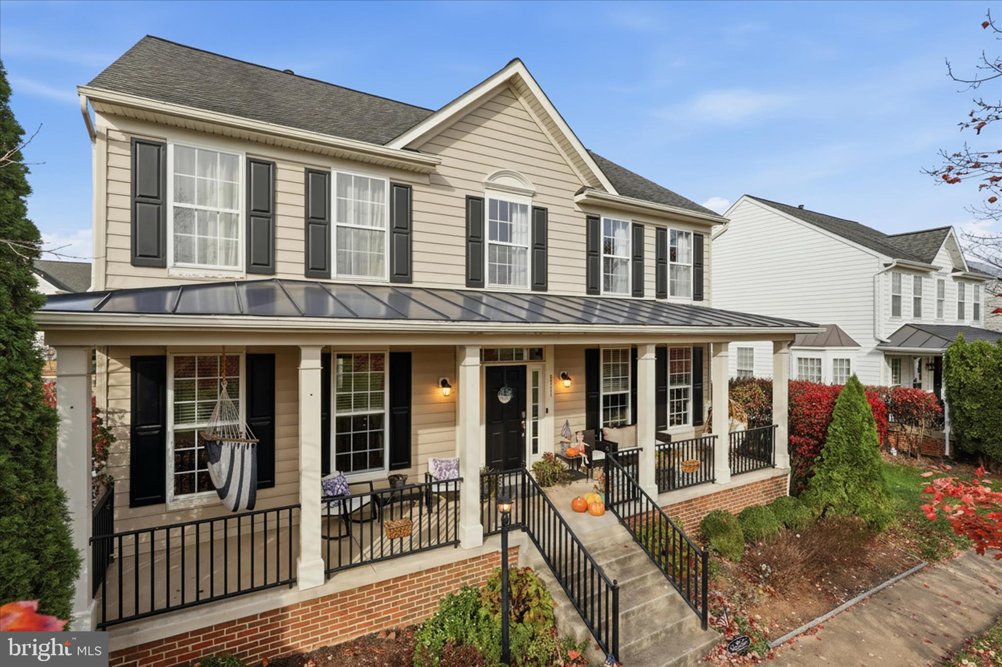 6711 Selbourne Lane Gainesville, VA 20155 - Photo 2 of 55 a view of a brick house with large windows and plants