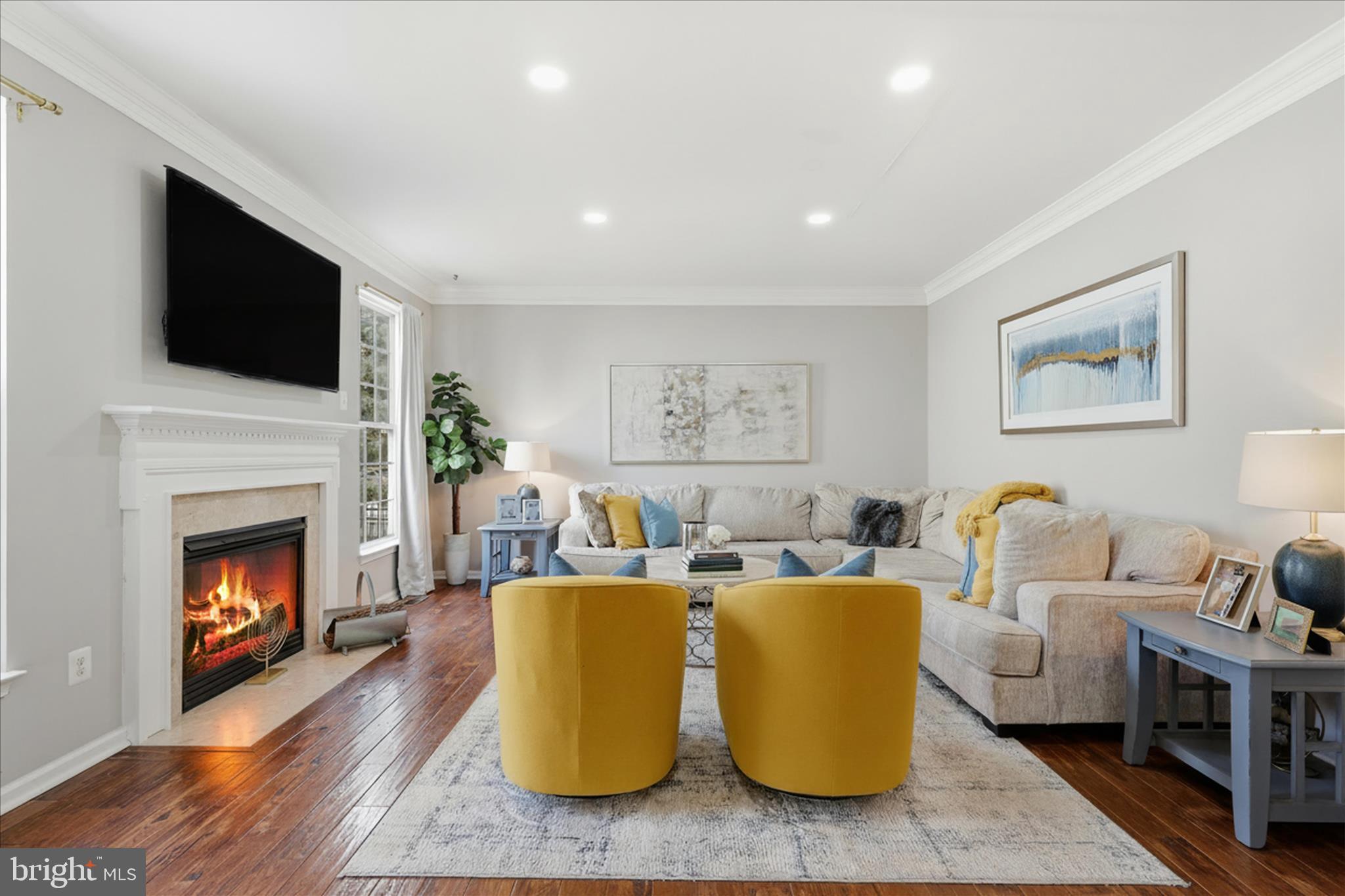 6711 Selbourne Lane Gainesville, VA 20155 - Photo 21 of 55 a living room with furniture fireplace and flat screen tv