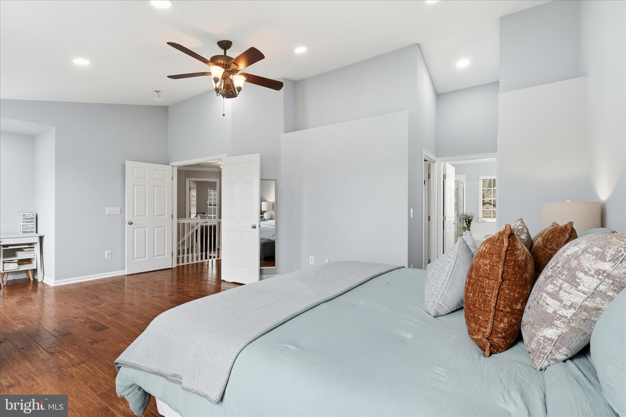 6711 Selbourne Lane Gainesville, VA 20155 - Photo 29 of 55 a spacious bedroom with a bed and a ceiling fan