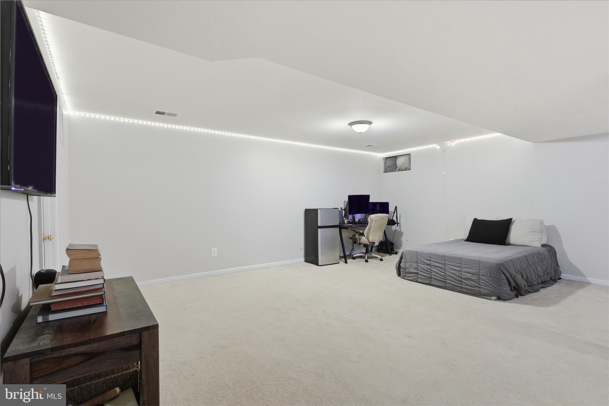 6711 Selbourne Lane Gainesville, VA 20155 - Photo 39 of 55 a bedroom with furniture and a flat screen tv