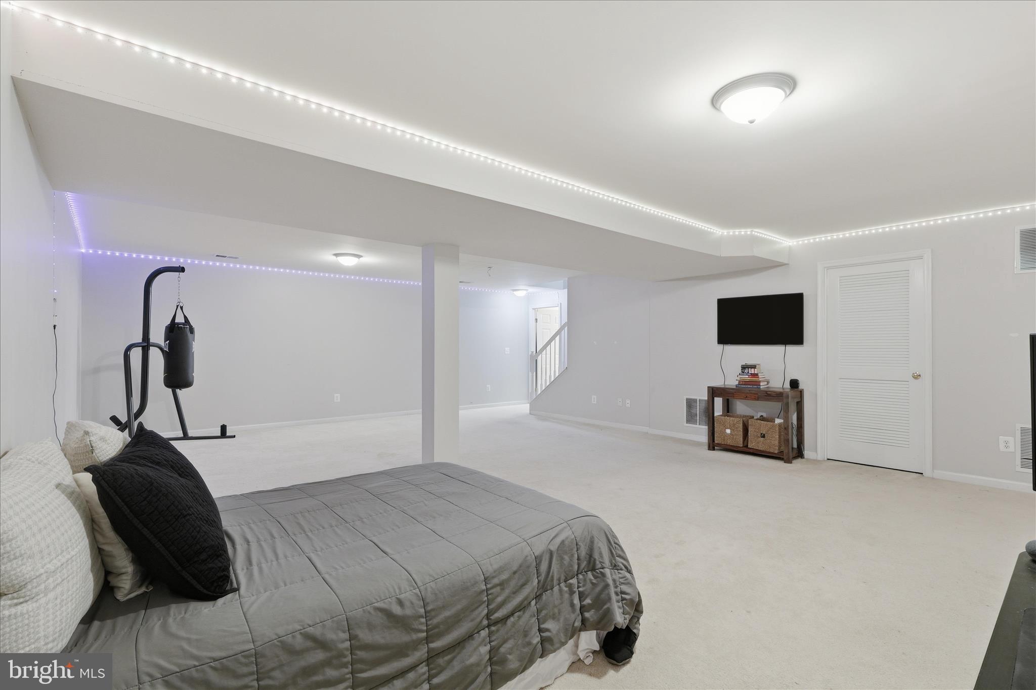 6711 Selbourne Lane Gainesville, VA 20155 - Photo 40 of 55 a bedroom with a bed and a flat screen tv