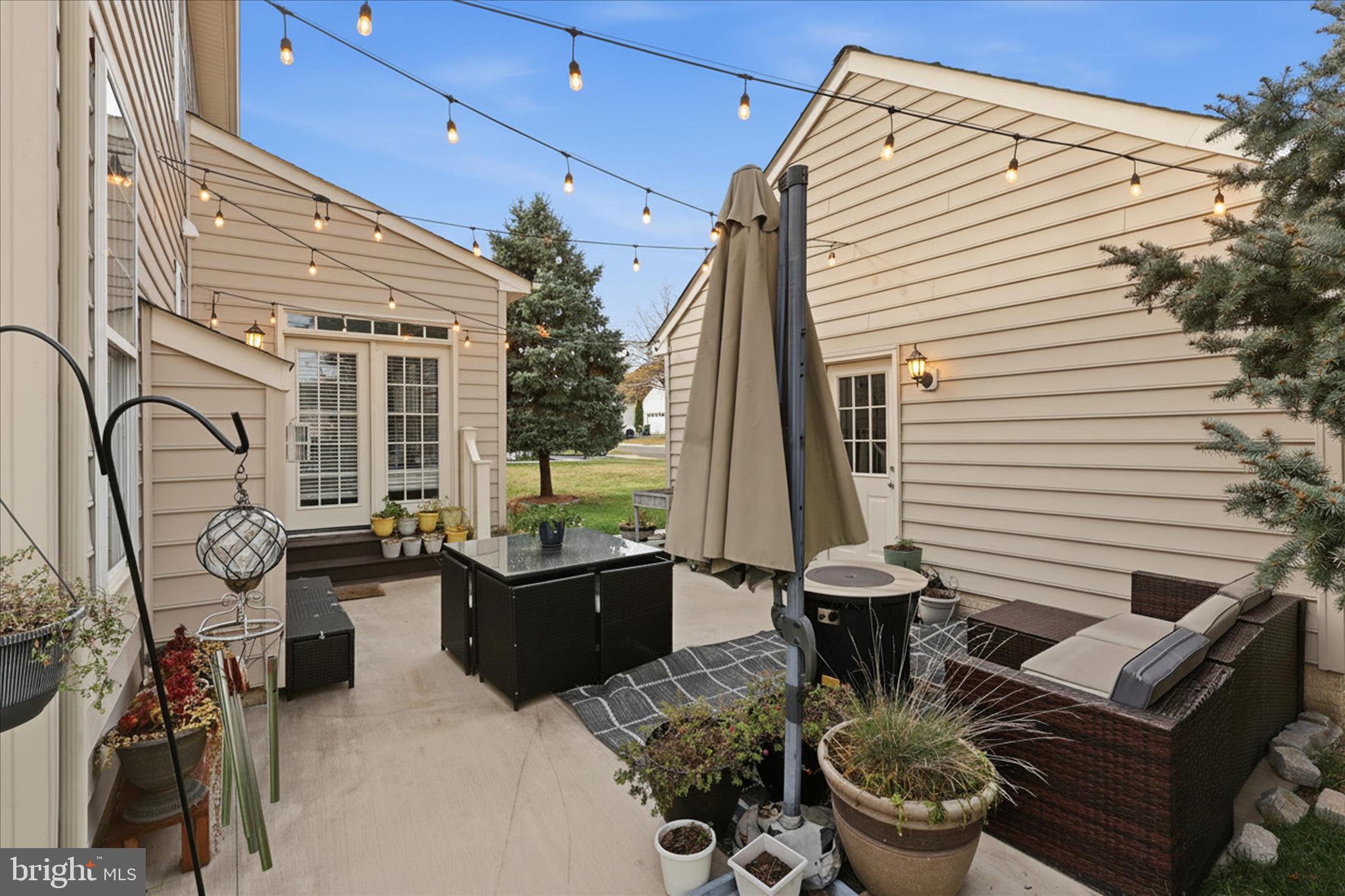 6711 Selbourne Lane Gainesville, VA 20155 - Photo 44 of 55 a view of a patio with couches chairs and a potted plant