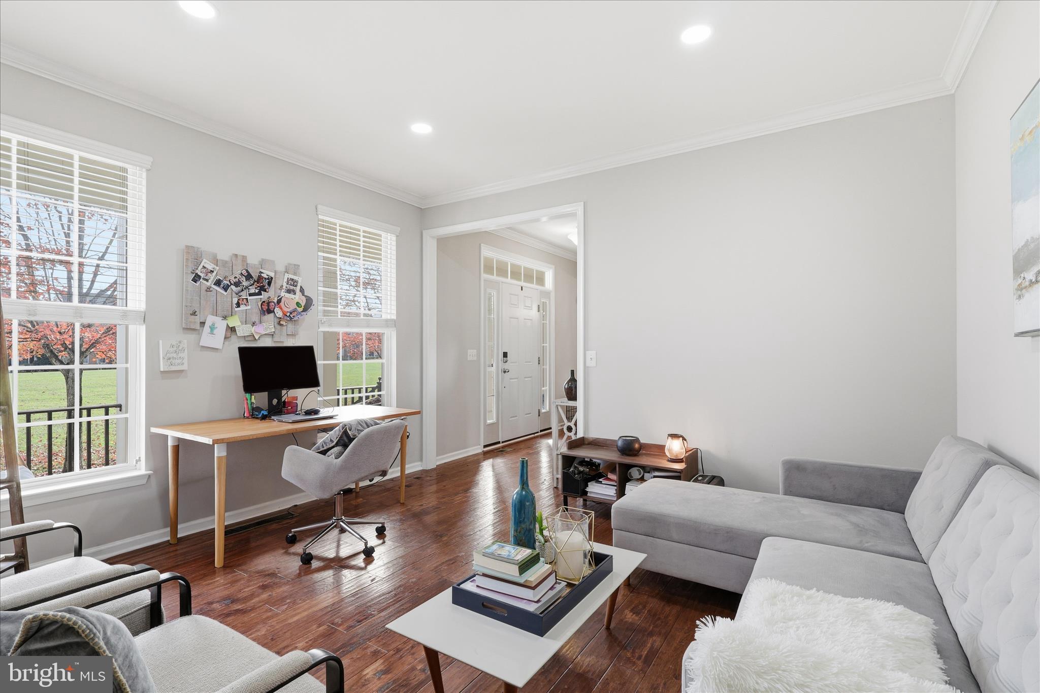 6711 Selbourne Lane Gainesville, VA 20155 - Photo 8 of 55 a living room with furniture and a flat screen tv