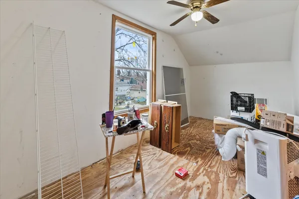 a bedroom with a bed and furniture