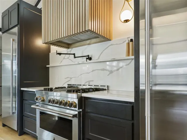a kitchen with a stove and a microwave