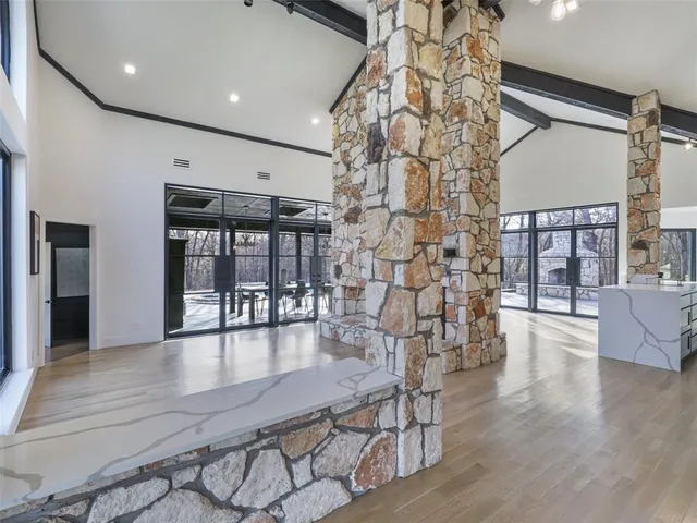 a lobby with furniture and floor to ceiling window