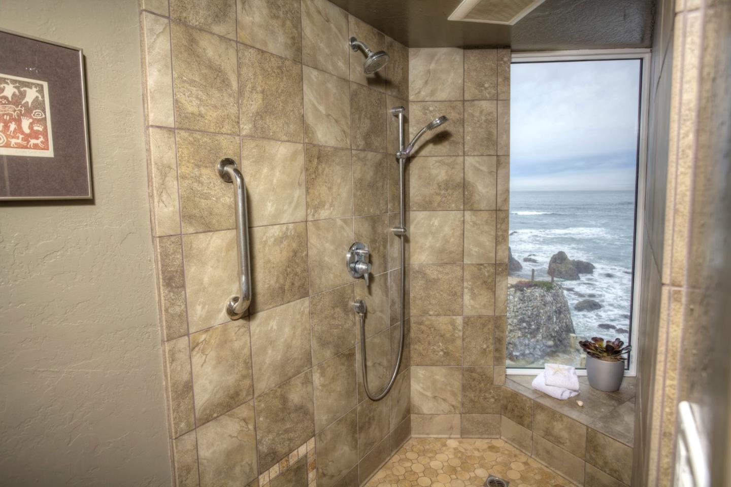 193 Reef Point Road Moss Beach, CA 94038 - Photo 15 of 27 a bathroom with a shower