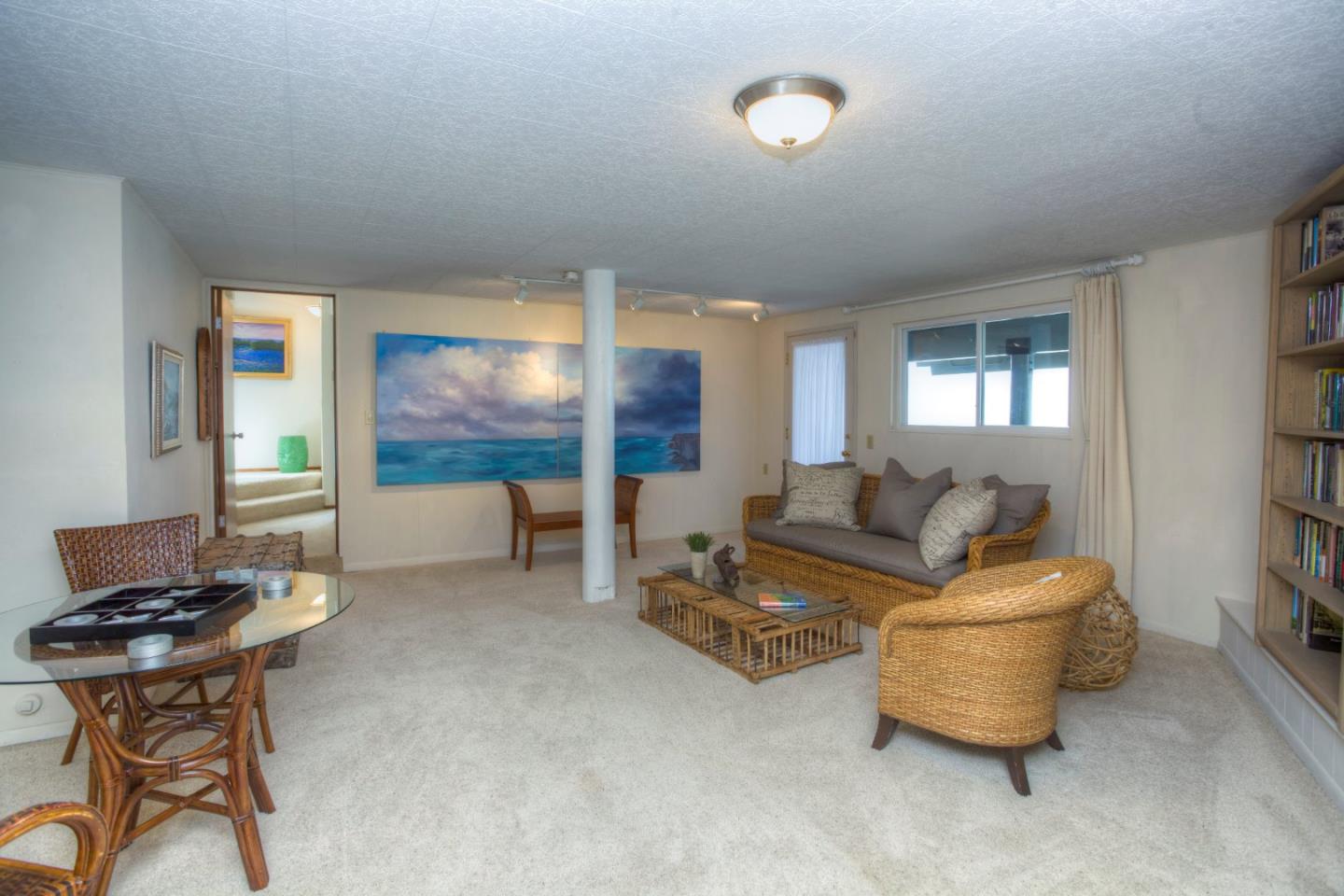 193 Reef Point Road Moss Beach, CA 94038 - Photo 23 of 27 a living room with furniture and a window