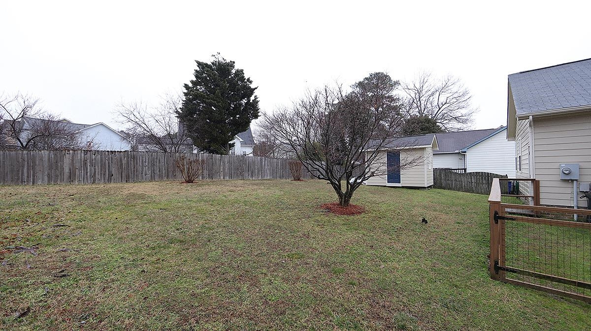 4012 Mardela Spring Drive Raleigh, NC 27616 - Photo 16 of 17 Back yard with view of storage shed to match home. Back Yard