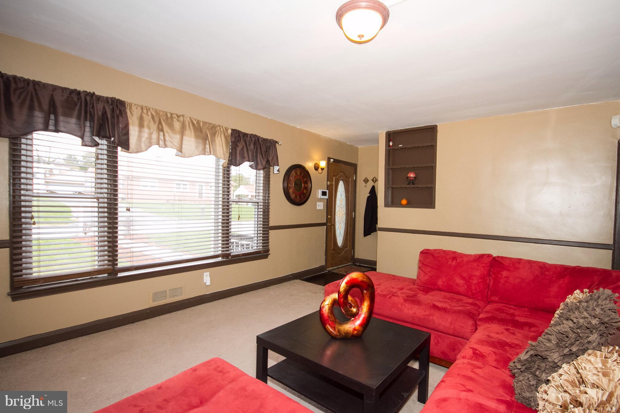 3631 Eitemiller Road Baltimore, MD 21244 - Photo 2 of 27 a living room with furniture and a large window