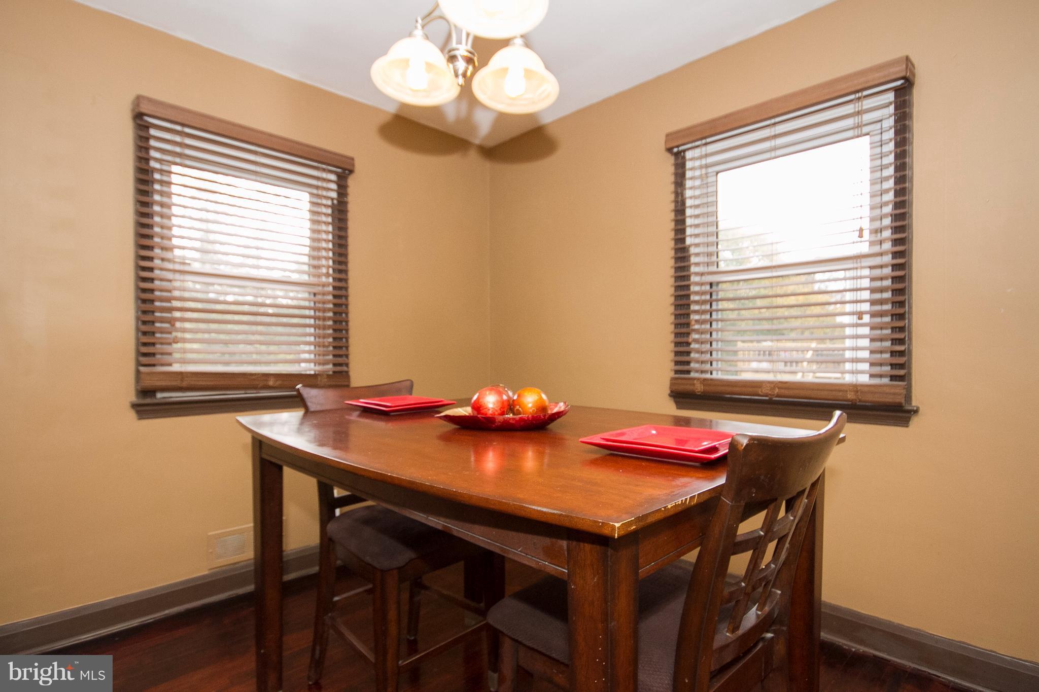 3631 Eitemiller Road Baltimore, MD 21244 - Photo 11 of 27 a dining room with a table and chairs