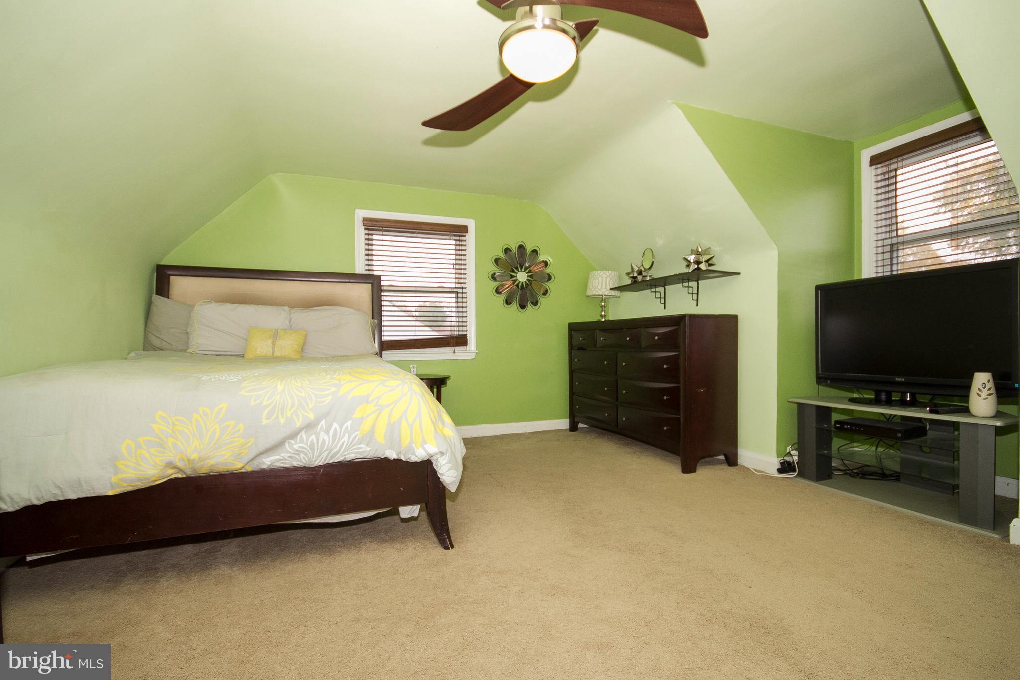 3631 Eitemiller Road Baltimore, MD 21244 - Photo 12 of 27 a bed room with a bed and a television