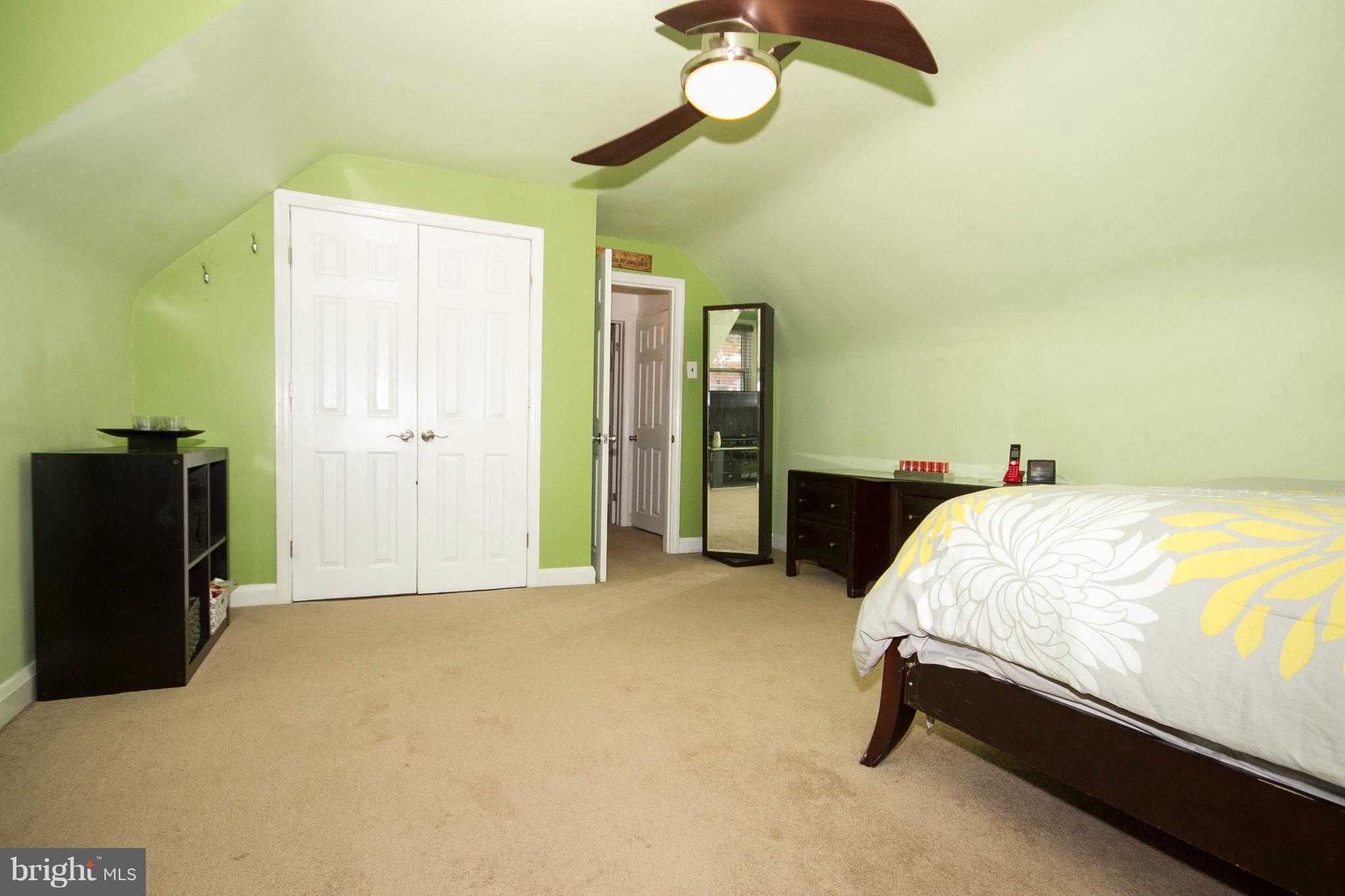 3631 Eitemiller Road Baltimore, MD 21244 - Photo 13 of 27 a bed room with a bed and a chandelier