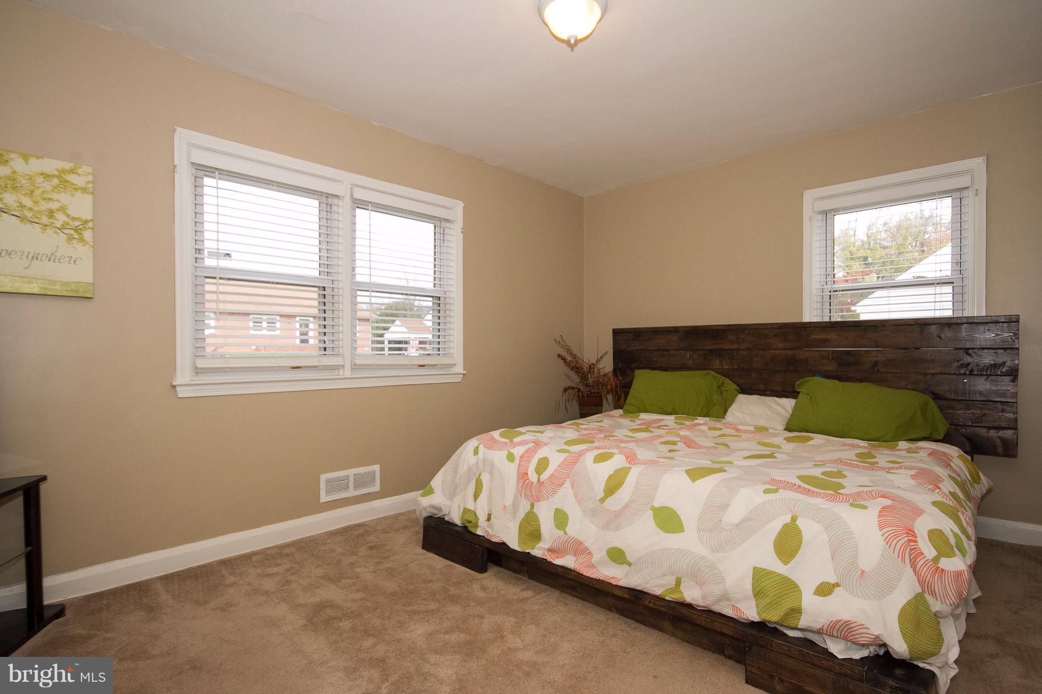 3631 Eitemiller Road Baltimore, MD 21244 - Photo 17 of 27 a bedroom with a bed and window