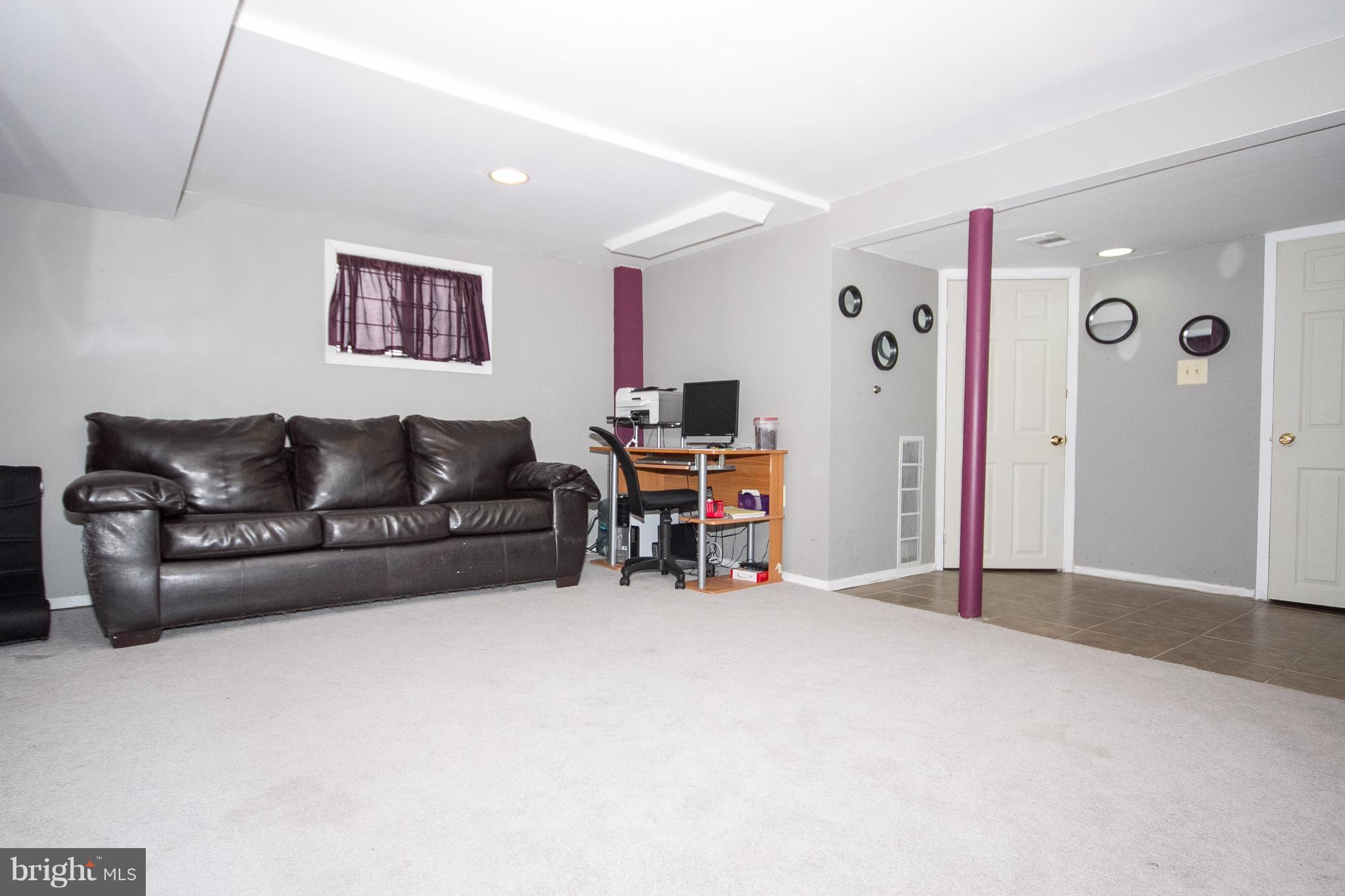 3631 Eitemiller Road Baltimore, MD 21244 - Photo 19 of 27 a living room with furniture and a large window