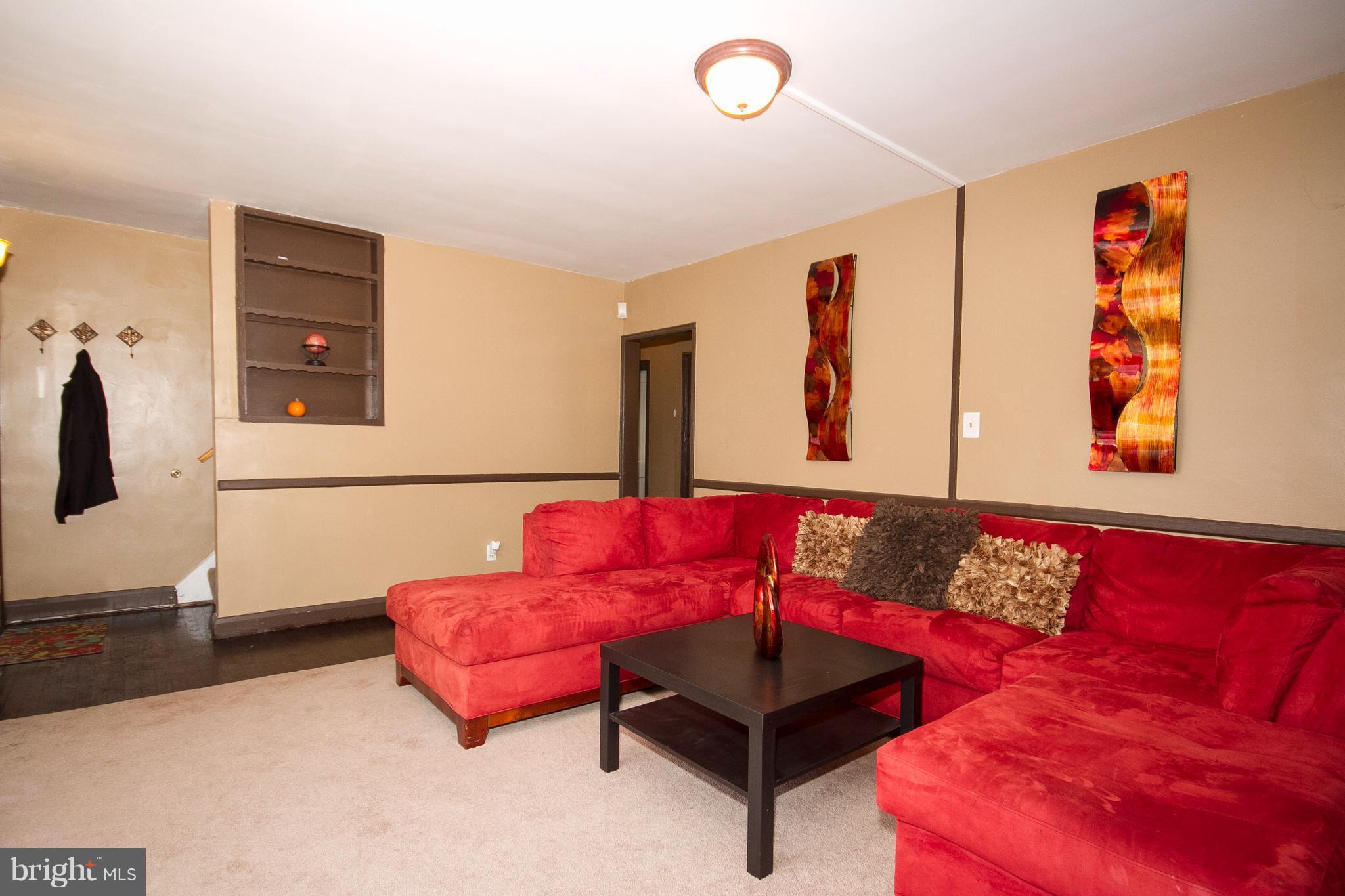 3631 Eitemiller Road Baltimore, MD 21244 - Photo 3 of 27 a living room with furniture and a couch