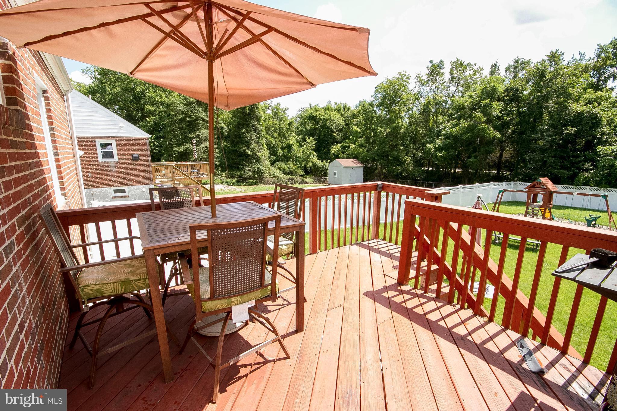 3631 Eitemiller Road Baltimore, MD 21244 - Photo 24 of 27 a view of balcony with wooden floor and outdoor seating