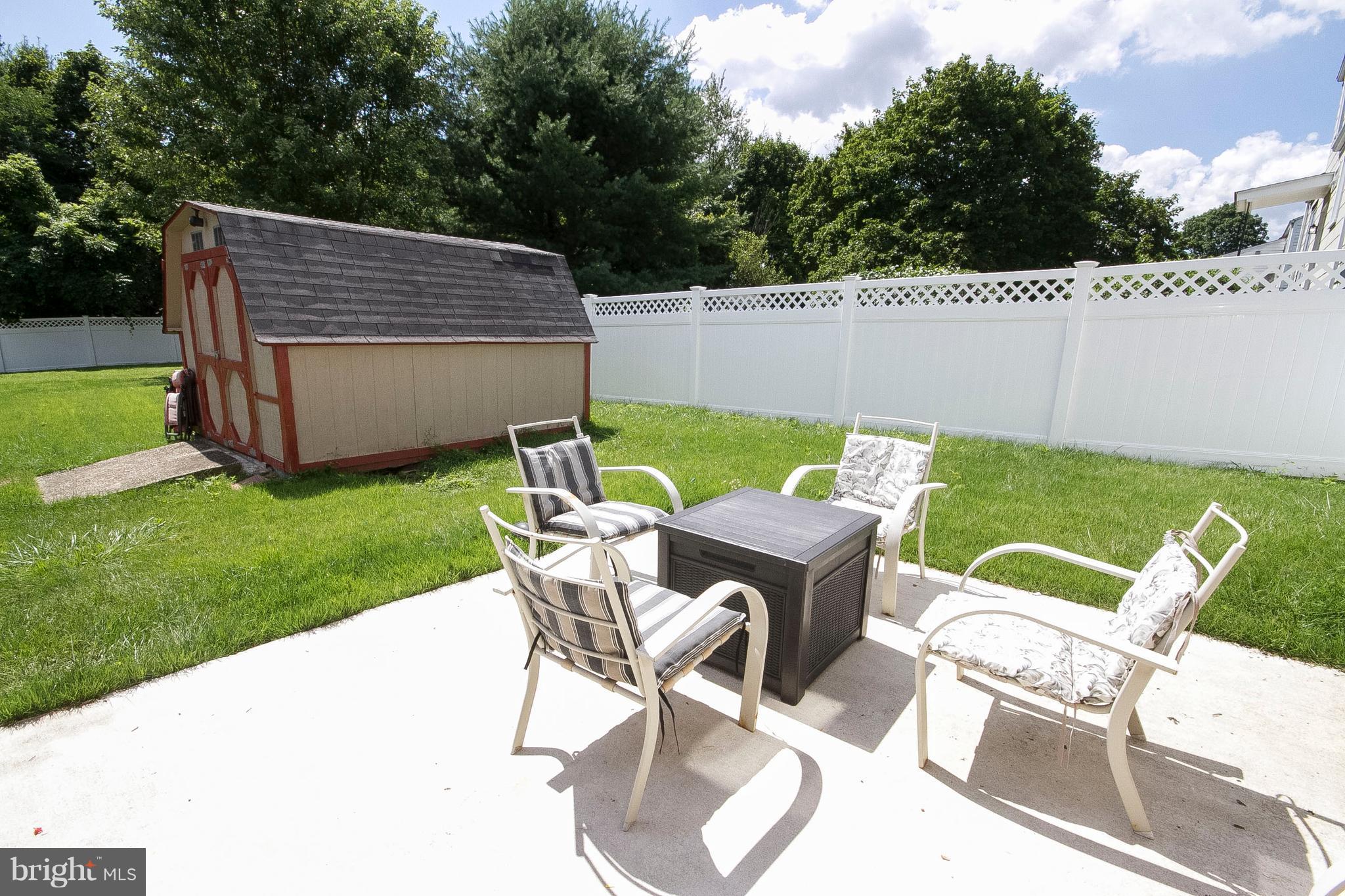 3631 Eitemiller Road Baltimore, MD 21244 - Photo 26 of 27 a patio with table and chairs