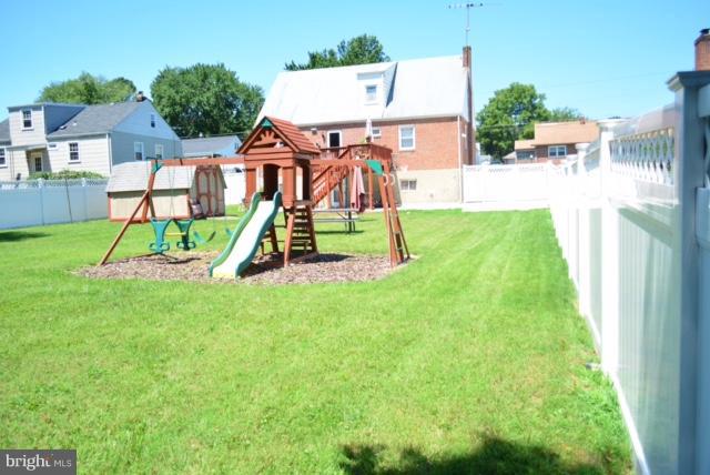 3631 Eitemiller Road Baltimore, MD 21244 - Photo 27 of 27 a view of backyard with a table and chairs