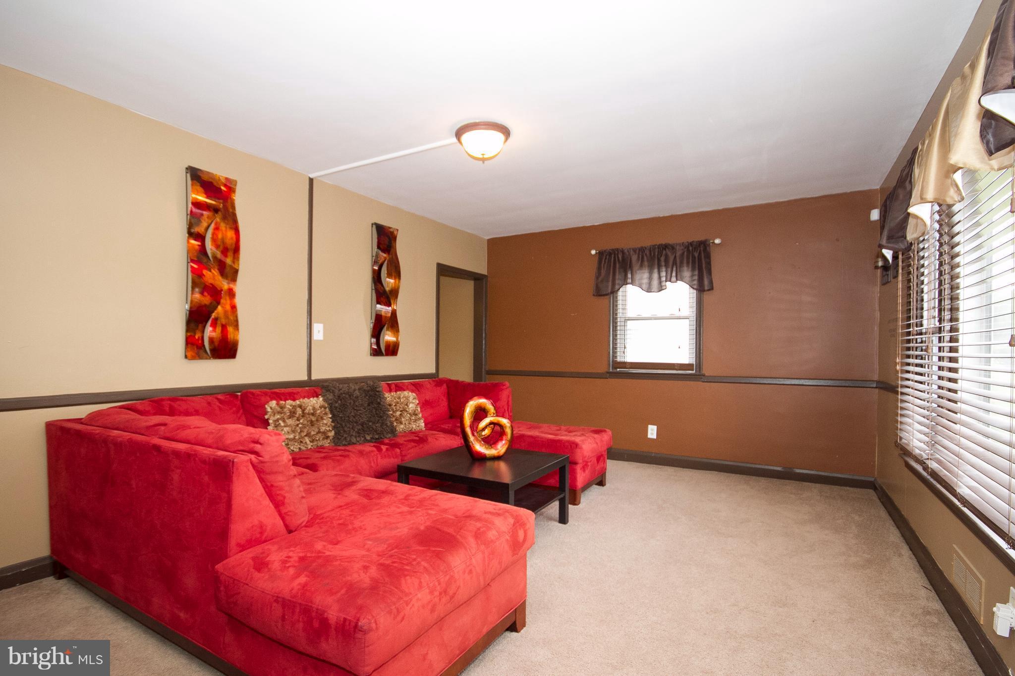 3631 Eitemiller Road Baltimore, MD 21244 - Photo 5 of 27 a bedroom with furniture and a window
