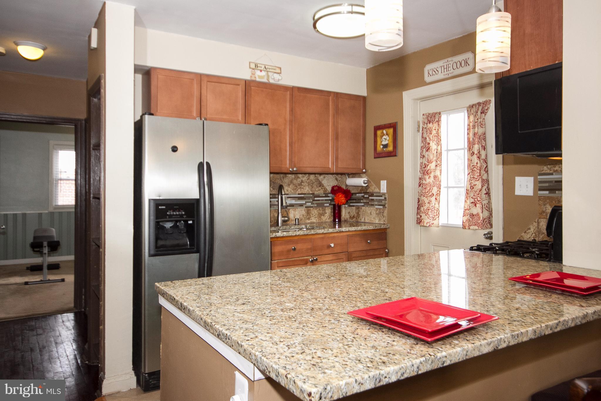 3631 Eitemiller Road Baltimore, MD 21244 - Photo 6 of 27 a kitchen with refrigerator and a sink
