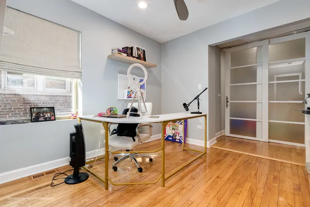 a view of workspace with wooden floor