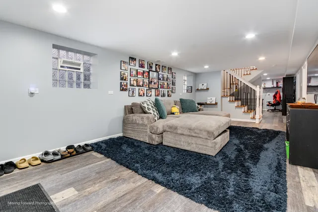 a living room with furniture and a book shelf