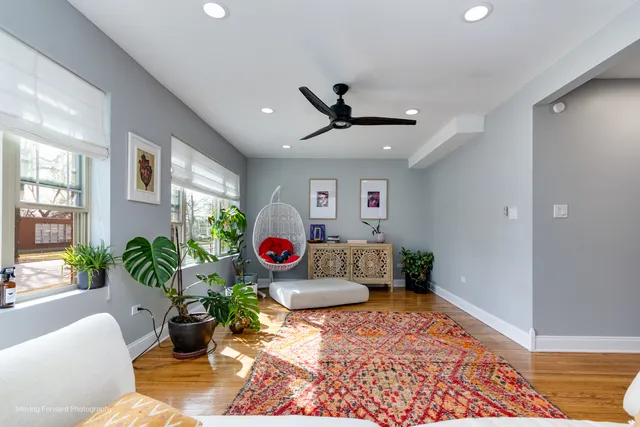 a living room with furniture and a rug
