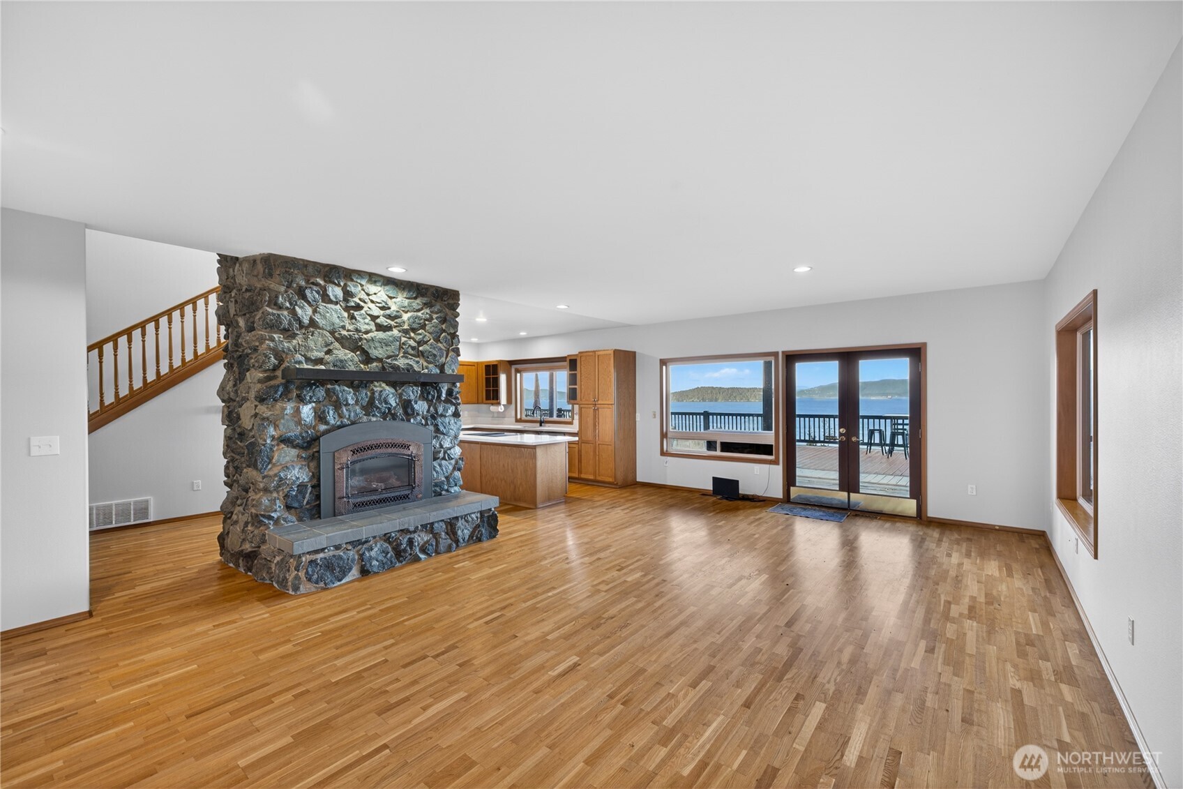 4623 Guemes Island Road Anacortes, WA 98221 - Photo 12 of 40 a living room with furniture and a fireplace