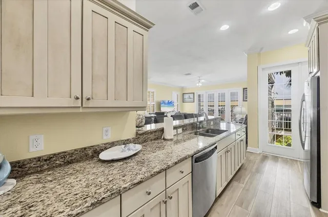 a kitchen with lots of counter space and wooden floor