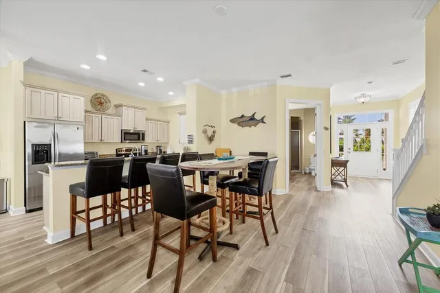 a view of a dining room with furniture and wooden floor