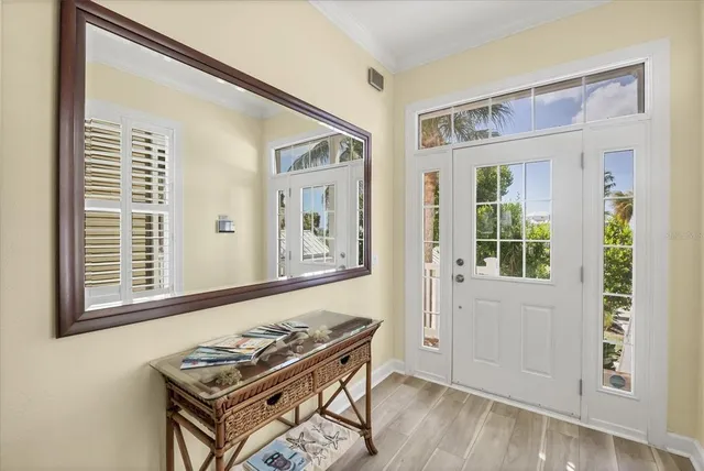 a living room with furniture and next to a window