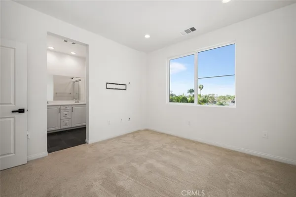 a dining room with furniture a chandelier and wooden floor