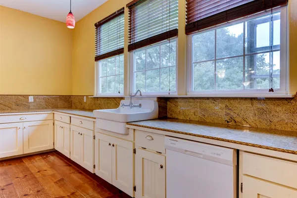 a kitchen with a sink and cabinets