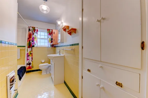 a bathroom with a sink and toilet