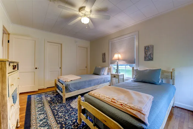 a bedroom with furniture and a rug