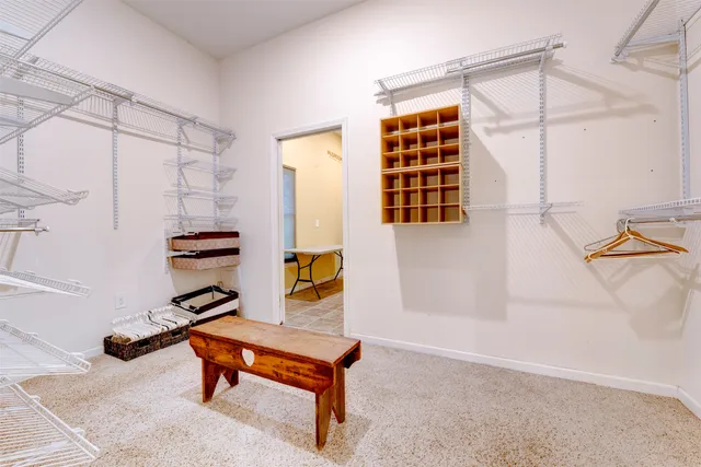a living room with furniture a rug and a window