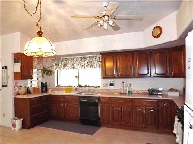 2097 Chevelon Road Overgaard, AZ 85933 - Photo 21 of 35 a kitchen with a sink and cabinets