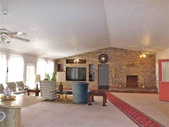2097 Chevelon Road Overgaard, AZ 85933 - Photo 23 of 35 a living room with furniture and a flat screen tv