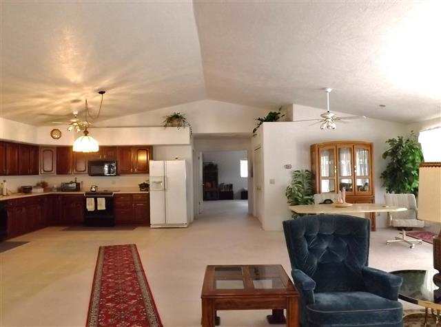 2097 Chevelon Road Overgaard, AZ 85933 - Photo 24 of 35 a living room with furniture and kitchen view