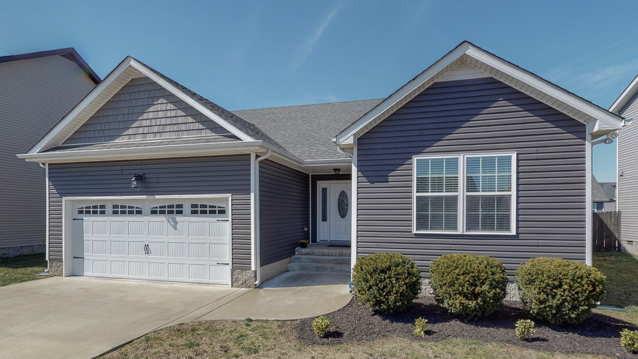 3788 Suiter Road Clarksville, TN 37040 - Photo 2 of 35 a front view of a house with a yard and garage