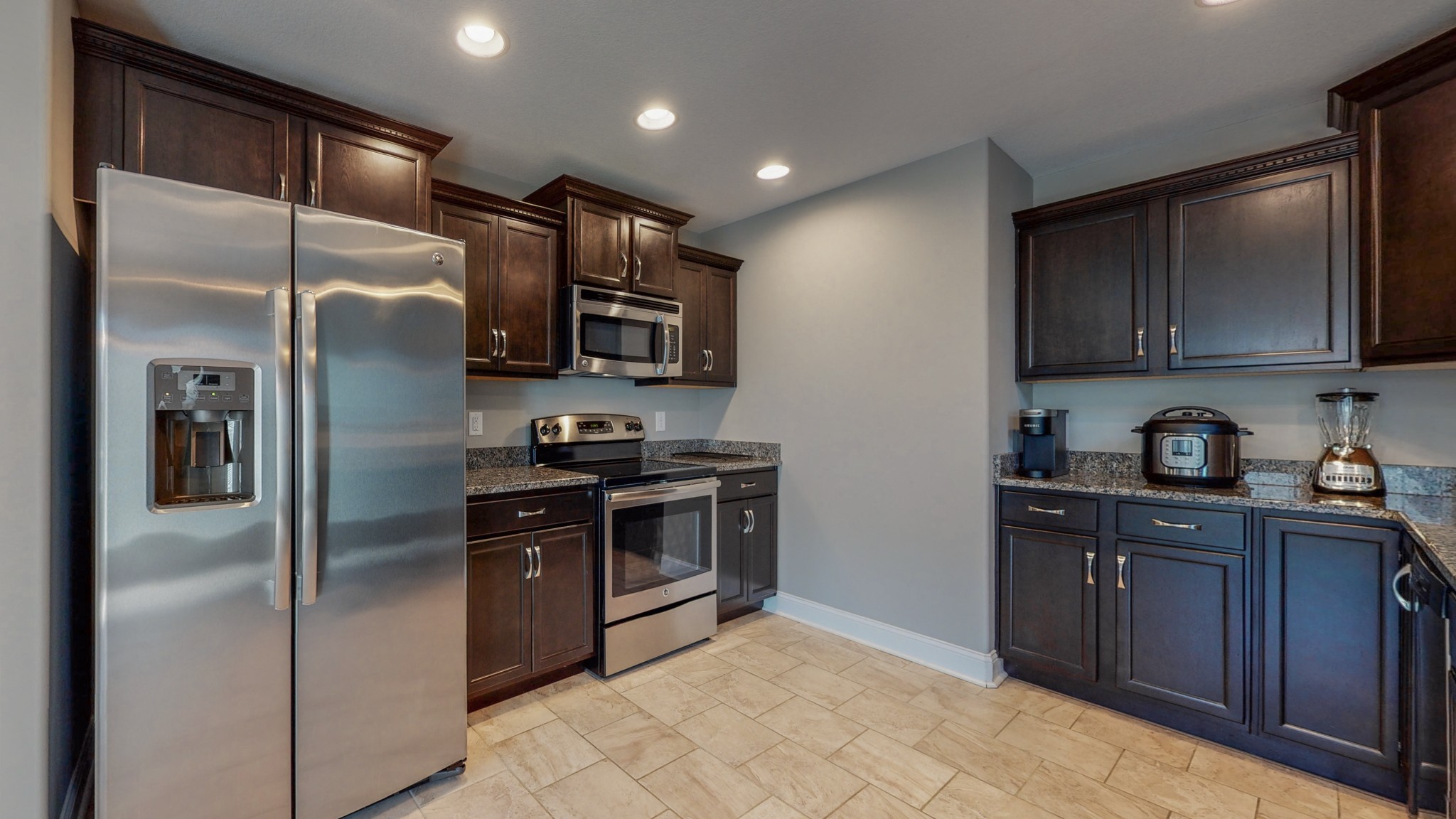 3788 Suiter Road Clarksville, TN 37040 - Photo 12 of 35 a kitchen with stainless steel appliances granite countertop a refrigerator a stove a sink and a microwave