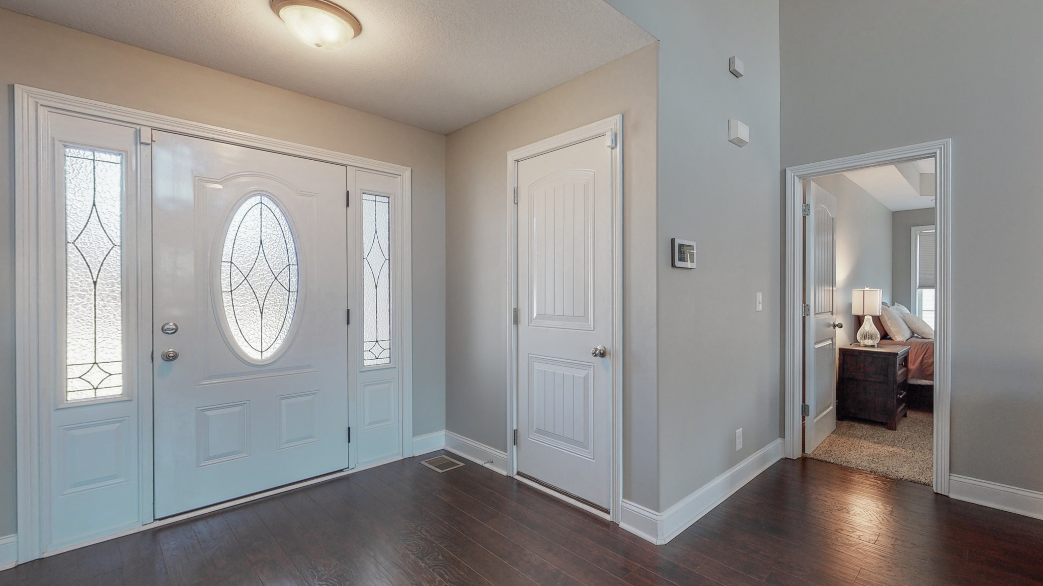 3788 Suiter Road Clarksville, TN 37040 - Photo 14 of 35 an empty room with wooden floor mirror and windows