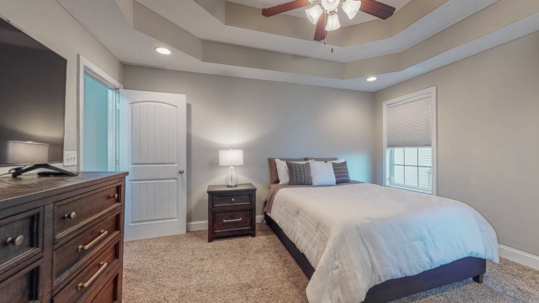 3788 Suiter Road Clarksville, TN 37040 - Photo 16 of 35 a bedroom with a bed and a chandelier