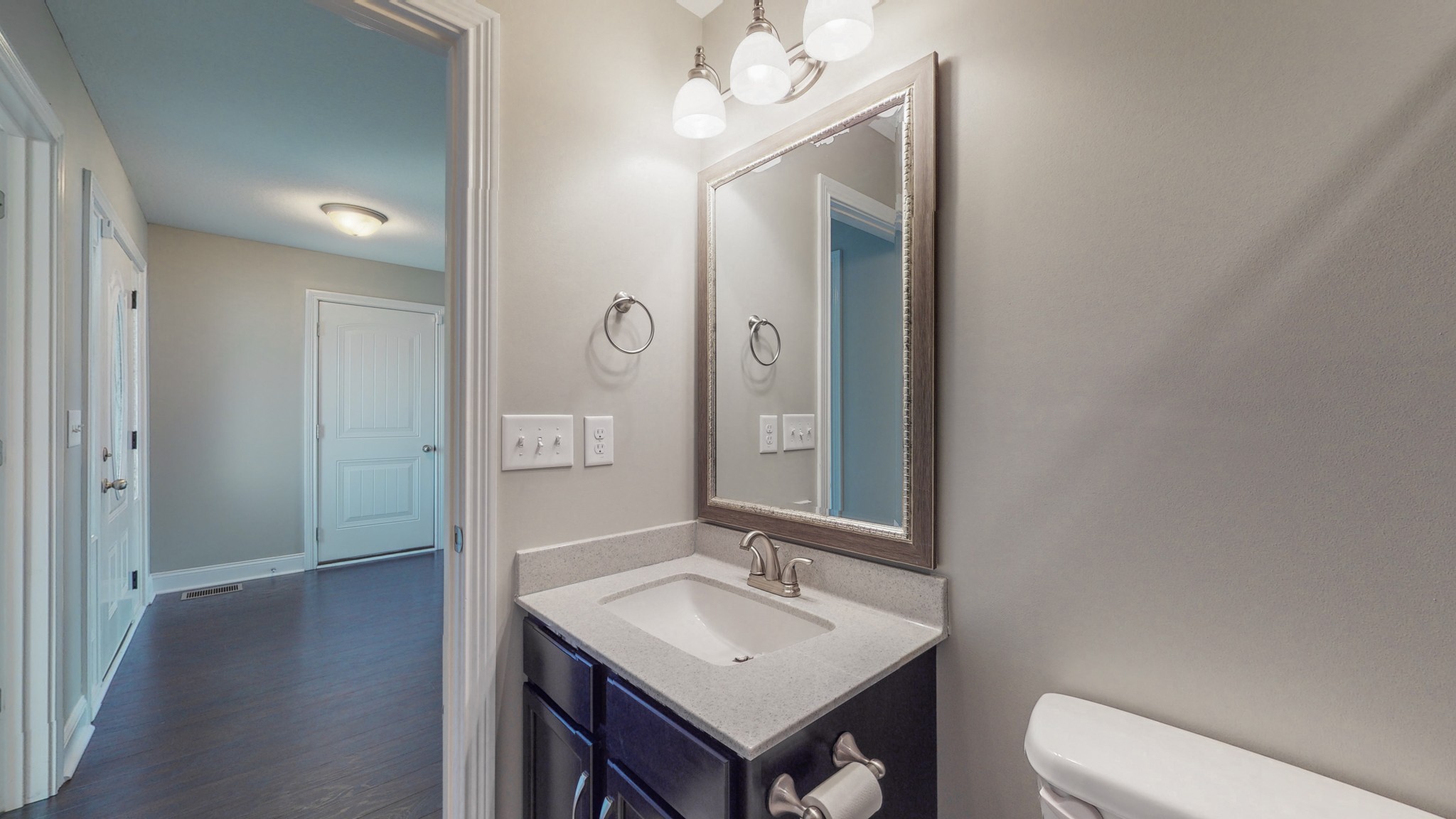 3788 Suiter Road Clarksville, TN 37040 - Photo 27 of 35 a bathroom with a toilet sink and mirror