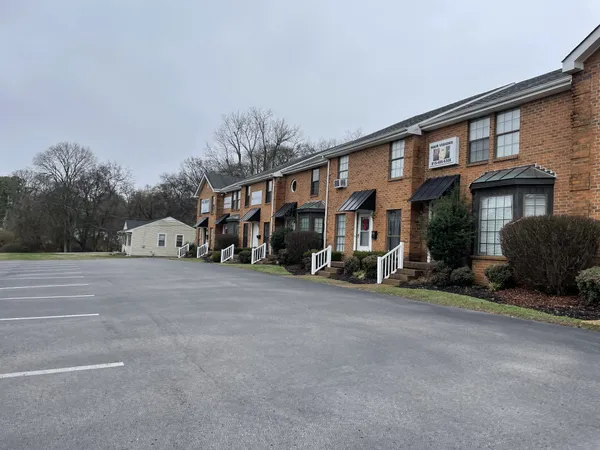 a view of a car park in front of house