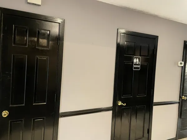 a view of a hallway with a microwave