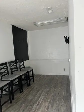 a view of a workspace with furniture